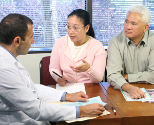 Woman and man talking to healthcare provider.