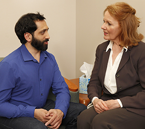 Man talking to mental health professional.