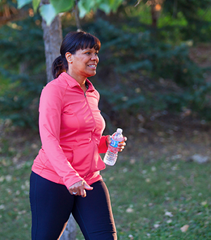 Woman walking in park.