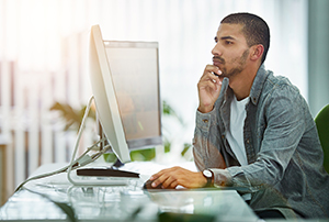 Man using a desktop computer.