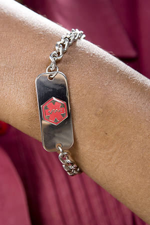 Close up of Medicalert bracelet.