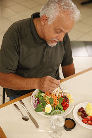 Man eating salad.